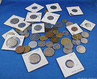 overview of all coins spread out on blue background