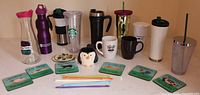 Overall lot showing all drinkware, coasters and straws