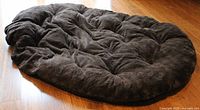 Full view of brown oval papasan cushion