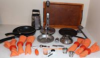 Group shot of all cookware, tray, holder, utensils, napkins