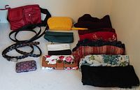 Overview of entire lot including shawls, belts, purse and wallets