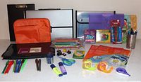 Overall view of all stationery items on countertop including document cases, folders, writing instruments and accessories