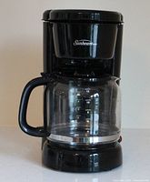 Front view showing entire coffee maker and carafe