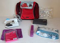 Overview of all travel accessories on table