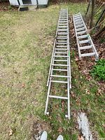 Full view of both ladder sections laid on ground