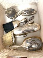 Overview of all grooming pieces in storage bin