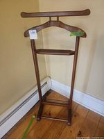 Full view of wooden valet stand front