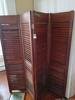 Overall view of four-panel wooden shutter divider folded