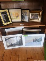 Overview of all six artworks on shelf
