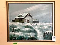 Front view of framed winter landscape painting