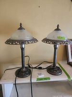 Both matching table lamps showing bases, cords, metal rims and glass shades