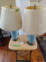 Both lamps on accent table showing overall lot