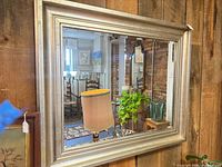 Full view of mirror showing frame style and reflection