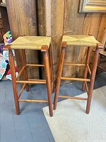 Both wooden bar stools front view