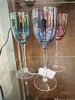 Front view of all three iridescent cordial glasses