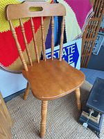 Full view of maple side chair showing spindle back and overall design