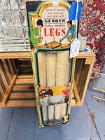 Front of original Gerber box showing four tapered legs inside