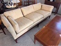 full view of Drexel Heritage sofa with cushions and wood legs