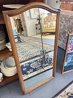 Front view of Ethan Allen wood-framed arched mirror