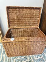 Wicker trunk open showing interior and woven construction