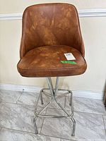 Full view of bar chair showing seat, backrest and chrome base