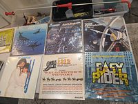 Six albums laid out including Easy Rider, 2001, Fourth Dimension, Ravel, 1812/Wellington’s Victory