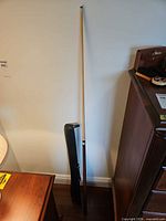 Full view of assembled pool cue with case