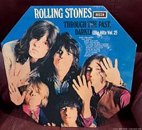 Front of octagonal gatefold sleeve with band portrait