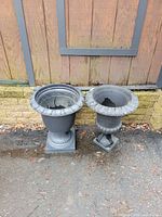 Both plastic urn planters side by side