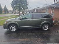 Driver-side profile of green 2018 Dodge Journey