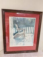 front view of framed print with red mat and Adirondack chair scene