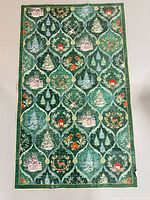Front view of rectangular Christmas motif rug
