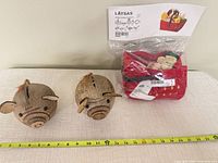 Full lot with sealed play food basket and two coconut pig banks visible