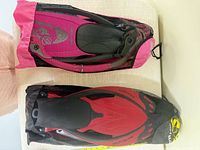 Two mesh bags containing fin sets, top view