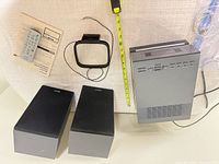 Complete lot showing remote, manuals, FM antenna, speakers, main unit