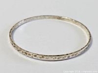 Top view of entire round hammered sterling bangle
