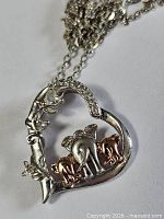 Heart elephant pendant close-up showing design and two-tone detail