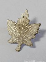 Front view of sterling silver maple leaf brooch
