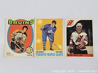Front view of three hockey trading cards showing players Rick Smith, Jim Dorey and Kirk Muller