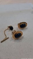 Carlton gold-tone oval blue cabochon cufflinks and tie tack
