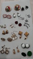 Overview of all earring pairs on display board