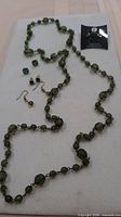 Whole lot showing necklace and earrings laid out