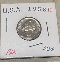 Obverse of 1958-D Jefferson nickel in holder