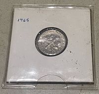 Reverse side of 1965 Roosevelt dime in holder