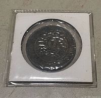 Coin in protective sleeve