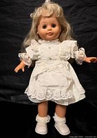 Full frontal view of doll in dress and shoes