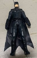 Front view showing full figure details including molded armor and cloth cape