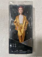 Front view of sealed Mattel BTS Jung Kook doll in window box