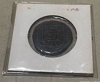 Obverse of coin in cardboard flip