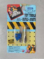 Front view of sealed DSI Home Improvement Mighty Mini toy tools blister pack